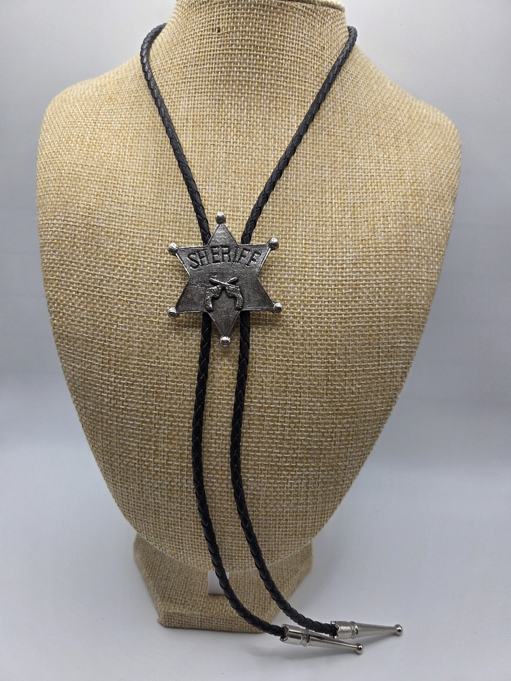 1726. Sheriff Star Western Bolo Tie - Black and Silver Tone